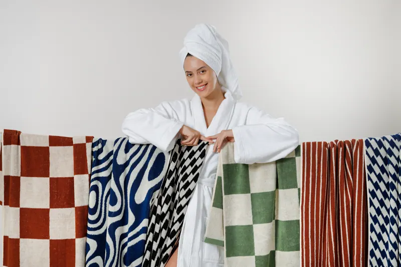Model with Emsworth jacquard towels on a line