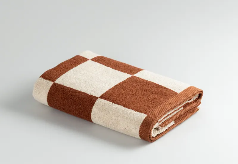 Check Terracotta towel, folded