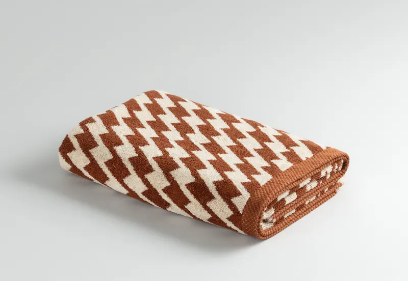 Harlequin Terracotta towel, folded