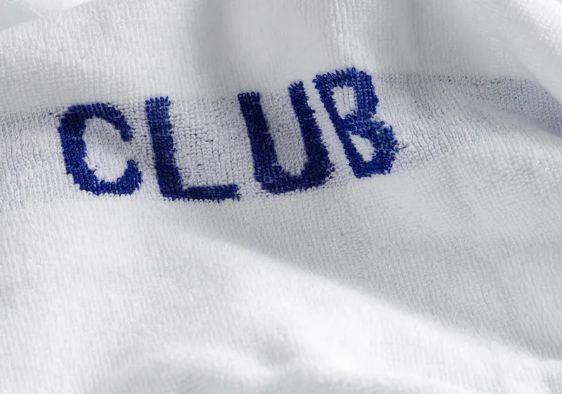 Navy embroidery on a white club towel