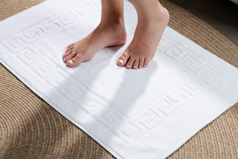 Woven white bath mat